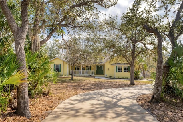 4050 Rock Creek Dr, Port Charlotte, FL 33948 - view of front facade featuring a porch and driveway