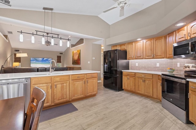 4050 Rock Creek Dr, Port Charlotte, FL 33948 - kitchen with lofted ceiling, stainless steel appliances, light countertops, pendant lighting, and a sink