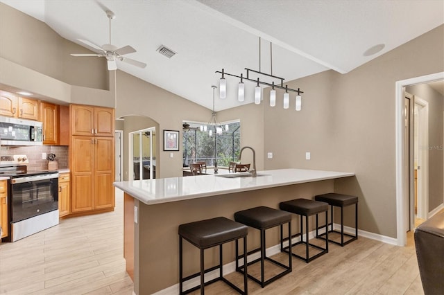 4050 Rock Creek Dr, Port Charlotte, FL 33948 - kitchen featuring a sink, visible vents, stainless steel appliances, and light countertops