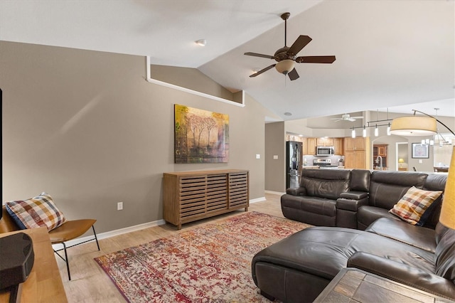 4050 Rock Creek Dr, Port Charlotte, FL 33948 - living area featuring light wood-style floors, baseboards, vaulted ceiling, and a ceiling fan
