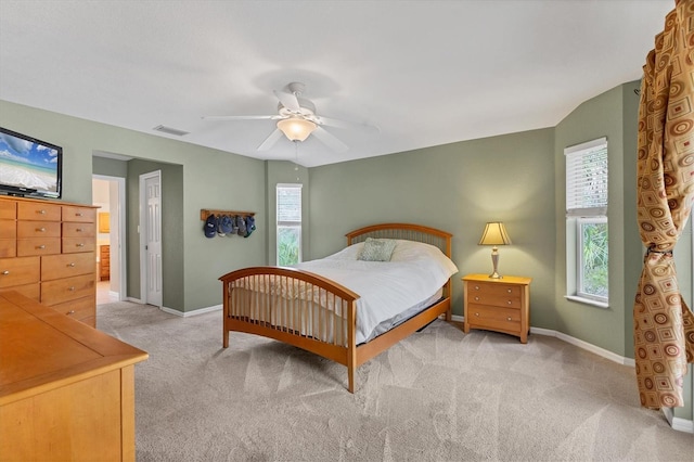 4050 Rock Creek Dr, Port Charlotte, FL 33948 - bedroom with visible vents, light carpet, baseboards, and multiple windows
