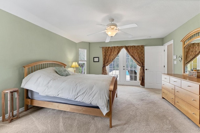 4050 Rock Creek Dr, Port Charlotte, FL 33948 - bedroom with ceiling fan, access to outside, french doors, and light colored carpet