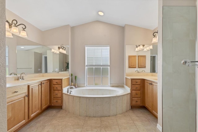 4050 Rock Creek Dr, Port Charlotte, FL 33948 - full bath featuring lofted ceiling, a bath, a sink, tile patterned flooring, and two vanities
