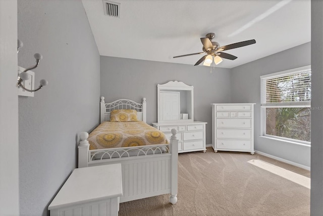 4050 Rock Creek Dr, Port Charlotte, FL 33948 - bedroom with light carpet, ceiling fan, visible vents, and baseboards