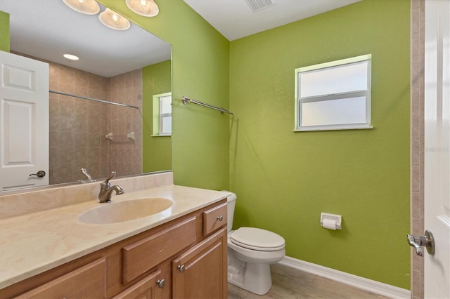 4050 Rock Creek Dr, Port Charlotte, FL 33948 - full bathroom featuring toilet, vanity, wood finished floors, baseboards, and walk in shower