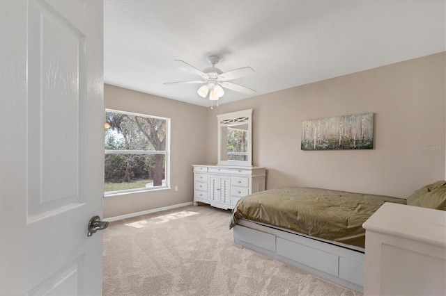 4050 Rock Creek Dr, Port Charlotte, FL 33948 - bedroom with light carpet, ceiling fan, and baseboards