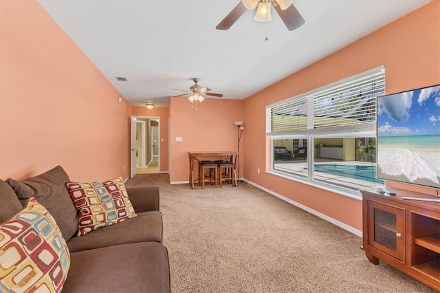 4050 Rock Creek Dr, Port Charlotte, FL 33948 - living area featuring baseboards, ceiling fan, visible vents, and light colored carpet