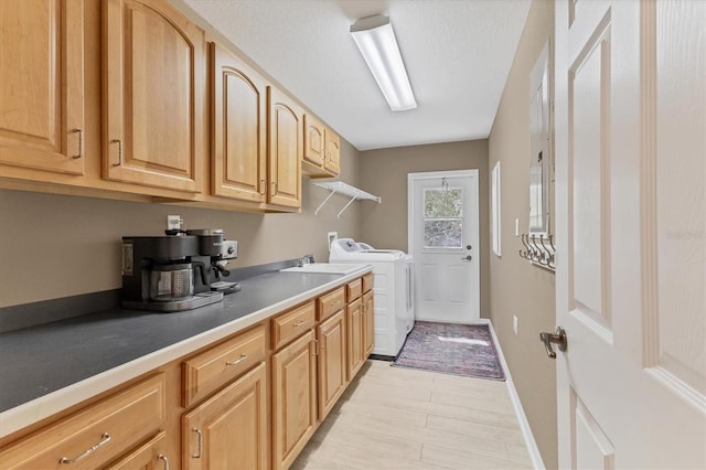 4050 Rock Creek Dr, Port Charlotte, FL 33948 - laundry room featuring hookup for a washing machine, a sink, a textured ceiling, laundry area, and baseboards