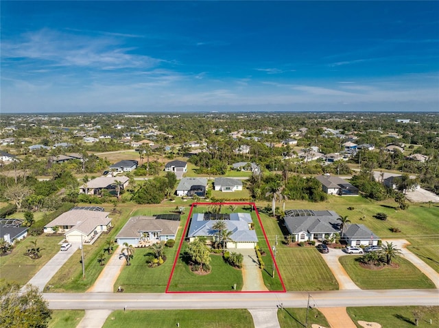 birds eye view of property with a residential view