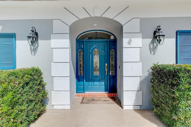 doorway to property with stucco siding