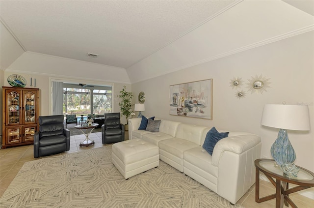 living room featuring crown molding, visible vents, vaulted ceiling, and light tile patterned floors