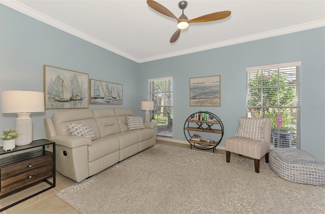 living room with light tile patterned floors, plenty of natural light, a ceiling fan, and crown molding