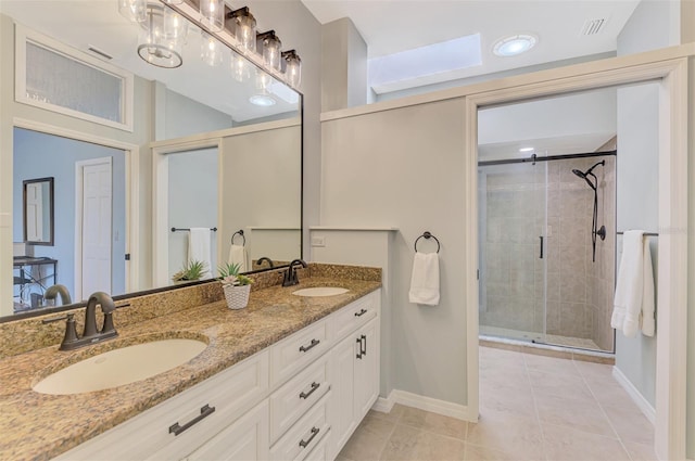 full bathroom with double vanity, a stall shower, a sink, and visible vents