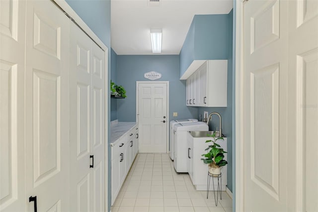 laundry room with cabinet space, independent washer and dryer, visible vents, and light tile patterned floors