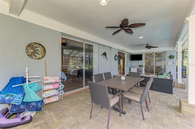 view of patio with a ceiling fan, outdoor dining space, and a grill