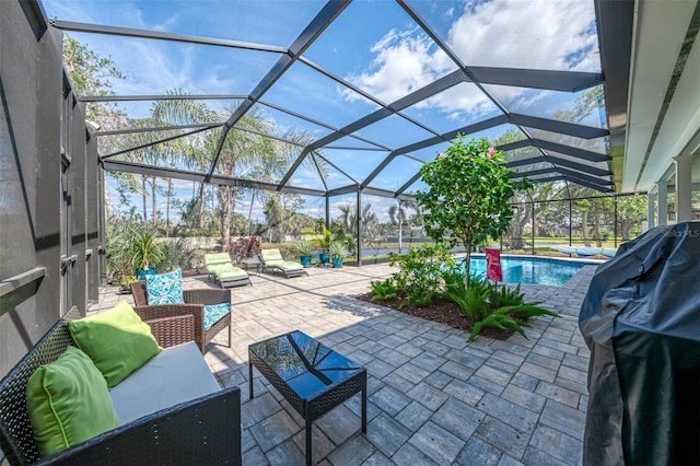 view of patio / terrace featuring a lanai, an outdoor pool, and an outdoor living space