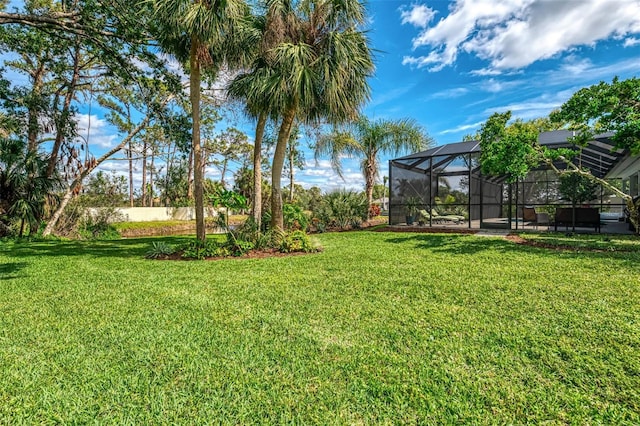 view of yard with a lanai