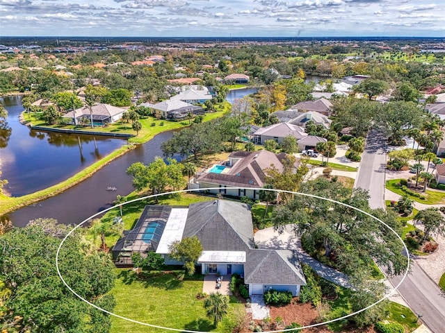 birds eye view of property featuring a water view and a residential view