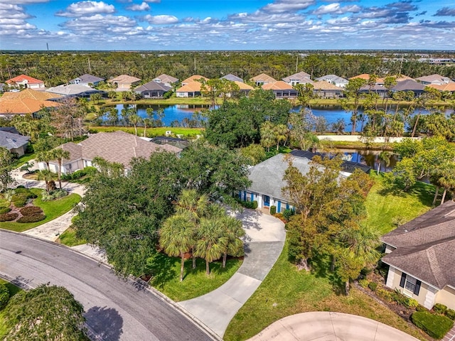 bird's eye view with a residential view and a water view