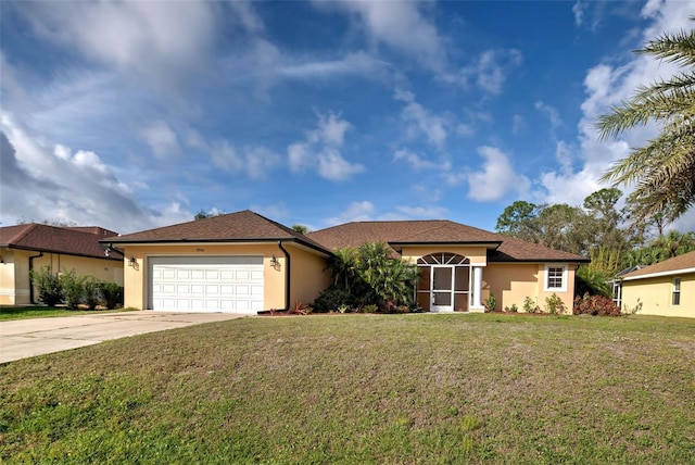 view of front of house with a front yard and a garage