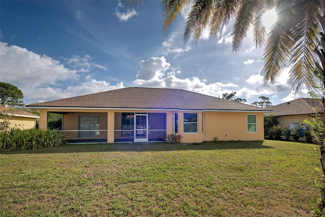 back of property featuring a lawn