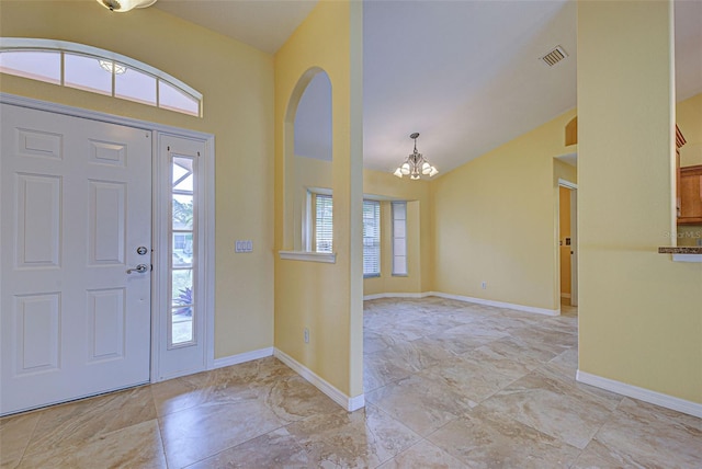 entryway featuring a chandelier