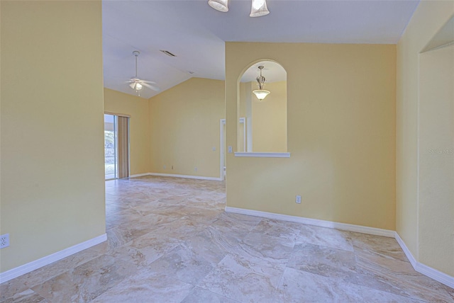 unfurnished room with ceiling fan and vaulted ceiling