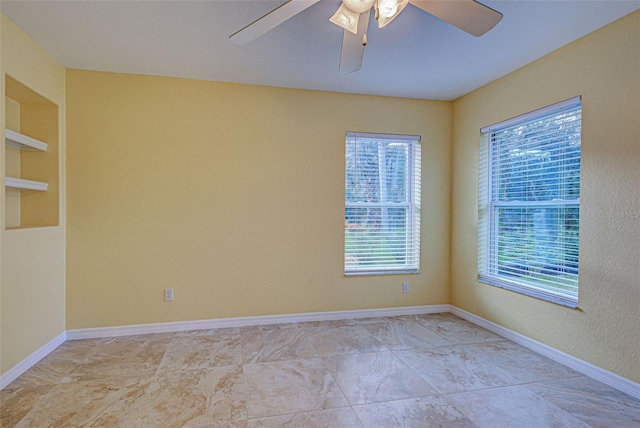 unfurnished room featuring ceiling fan