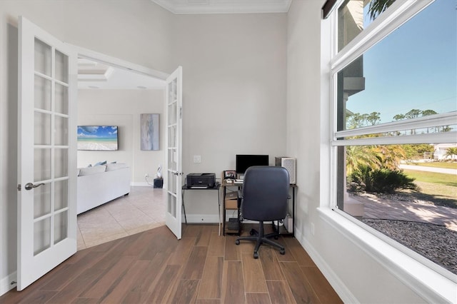 office featuring ornamental molding, french doors, baseboards, and wood finished floors