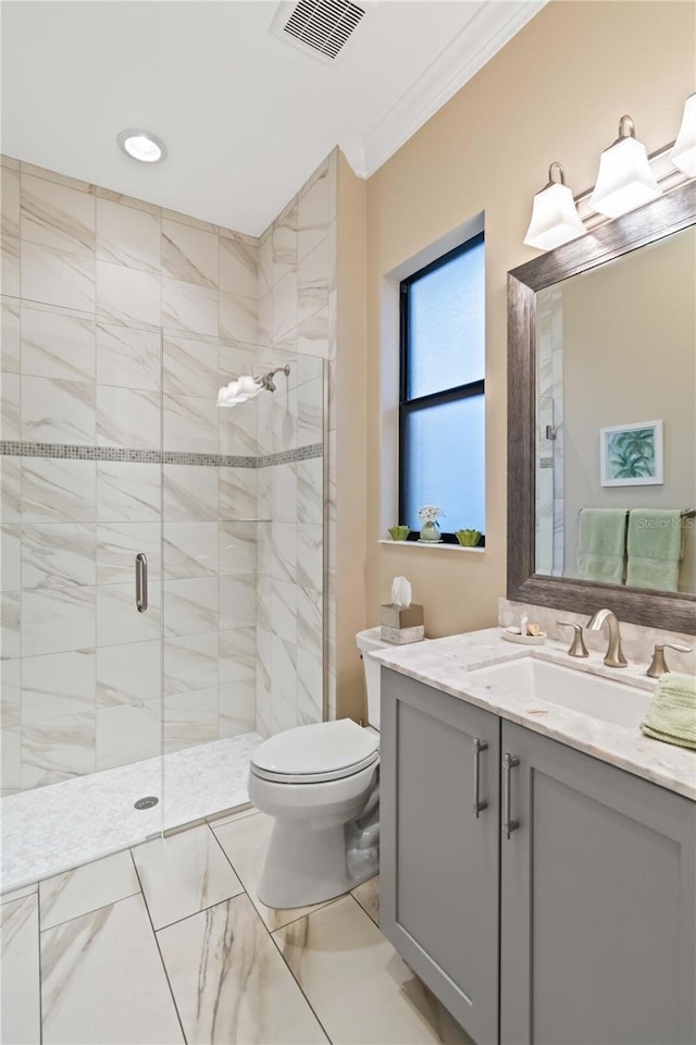 full bathroom featuring a stall shower, visible vents, toilet, ornamental molding, and vanity