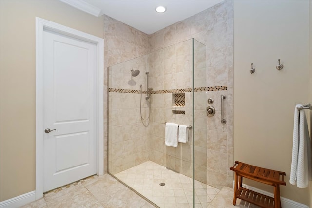 full bathroom with baseboards and a walk in shower