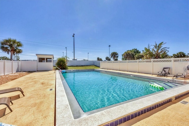 view of pool featuring a fenced backyard, a fenced in pool, and a patio