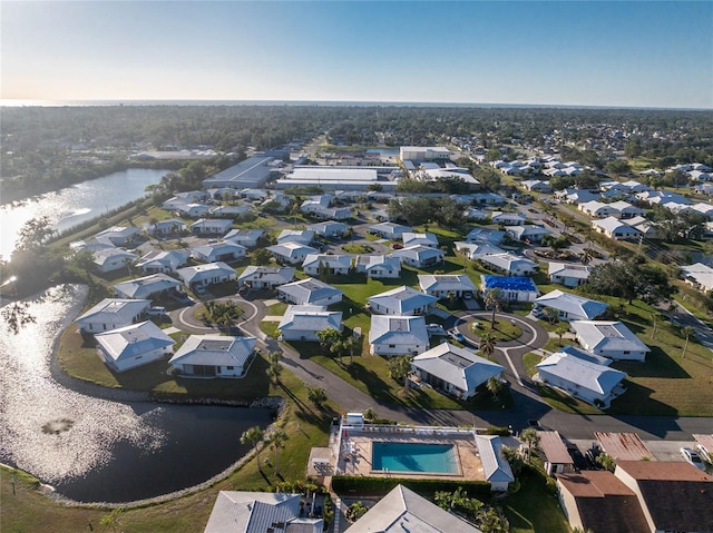 drone / aerial view with a residential view and a water view