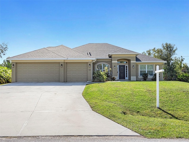 view of front of property with an attached garage, driveway, roof with shingles, stucco siding, and a front yard