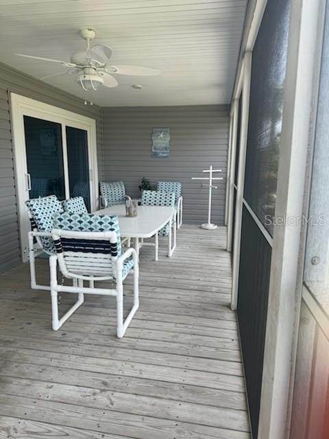 sunroom with a ceiling fan