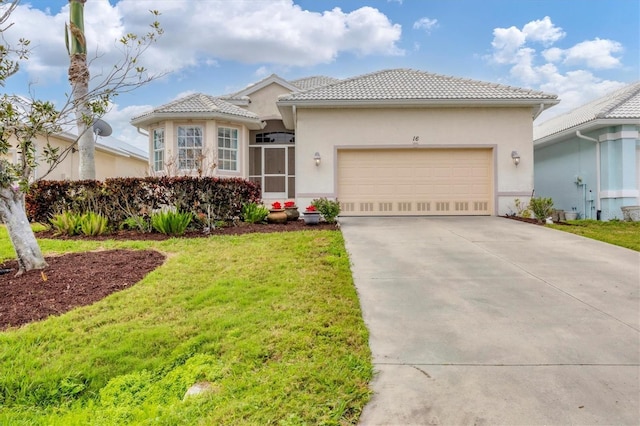 view of front of property featuring driveway, a tiled roof, an attached garage, a front lawn, and stucco siding