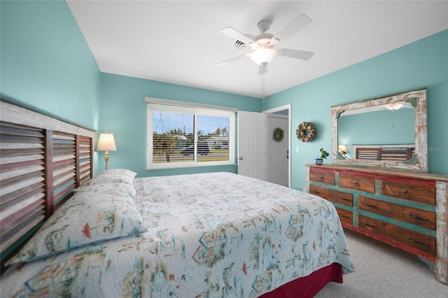 bedroom with light carpet and ceiling fan