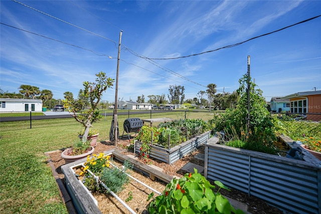 view of yard featuring a vegetable garden and fence