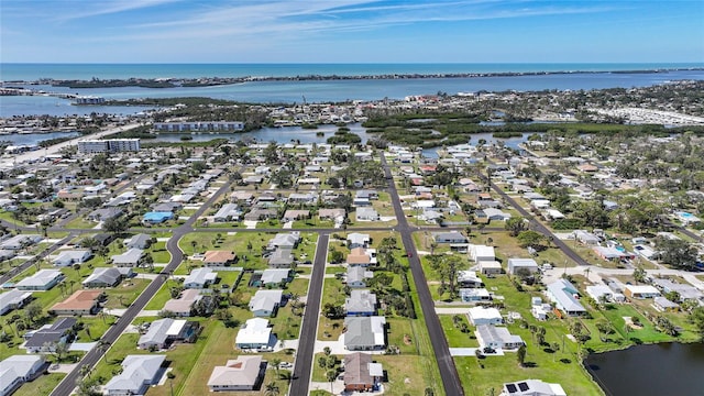 bird's eye view with a residential view and a water view