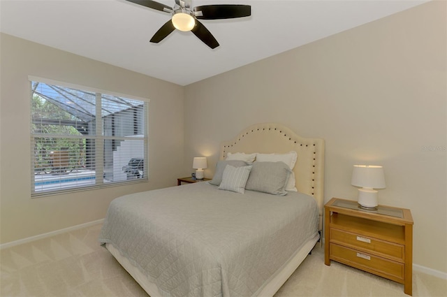 bedroom featuring carpet, a ceiling fan, and baseboards