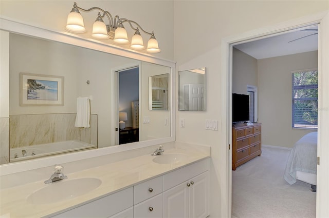 ensuite bathroom featuring a tub, connected bathroom, a sink, and double vanity