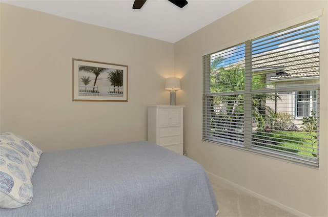 bedroom featuring carpet floors, baseboards, and a ceiling fan