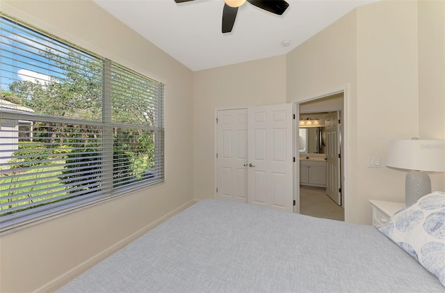 carpeted bedroom with a ceiling fan and baseboards