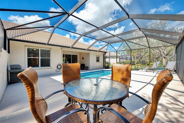 view of patio / terrace with glass enclosure, area for grilling, and an outdoor pool