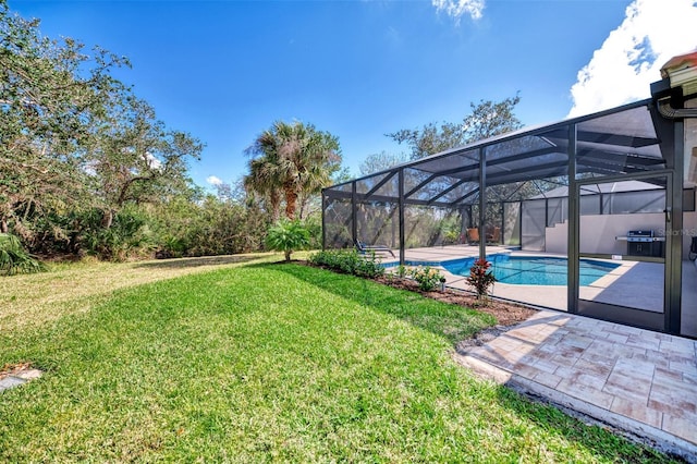 view of yard with a patio area, glass enclosure, and an outdoor pool