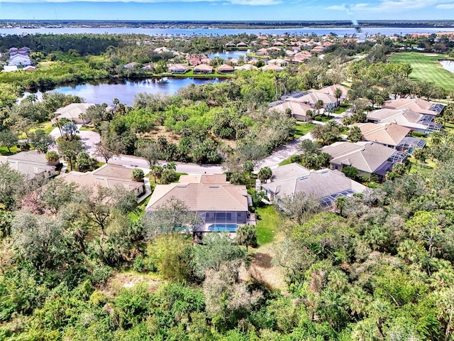 bird's eye view featuring a water view and a residential view