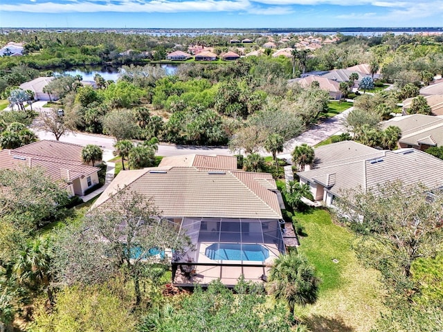 bird's eye view featuring a residential view and a water view