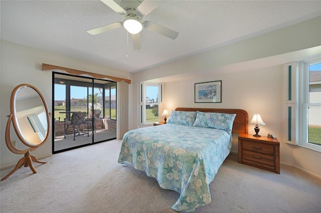 bedroom featuring light carpet, ceiling fan, a textured ceiling, and access to exterior