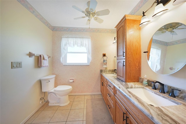 bathroom featuring ceiling fan, tile patterned flooring, and a sink