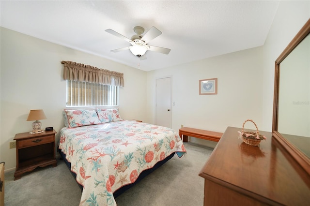 bedroom featuring a ceiling fan and light carpet